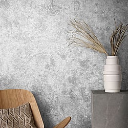 Galerie Wallcoverings Product Code 95020 - Air Wallpaper Collection - Grey Colours - This earthy wallpaper will be a warming welcome to your home and perfect on all four walls or accompanied by a complementing design. The wallpaper has a subtle emboss that creates some structural depth and comes in a mottled grey tones that are reminiscent of parched clay soil. It’s a great way to bring your room up to date with a natural and earthy feel. Design
